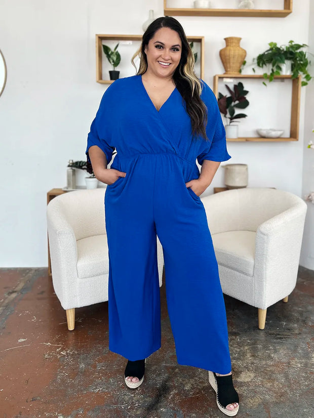 Double Take Full Size Surplice Wide Leg Jumpsuit with Pockets www.nizzadesign.com