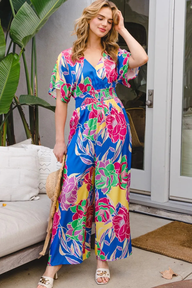 ODDI Full Size Floral Smocked Tied Back Jumpsuit www.nizzadesign.com