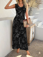Devine Printed Round Neck Sleeveless Tie Waist Jumpsuit Black www.nizzadesign.com
