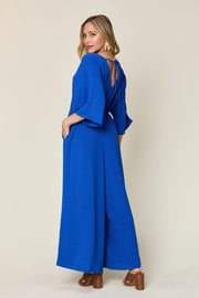 Double Take Full Size Surplice Wide Leg Jumpsuit with Pockets www.nizzadesign.com